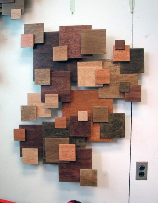 Abstract square wood block wall art in varying shades of natural wood tones.