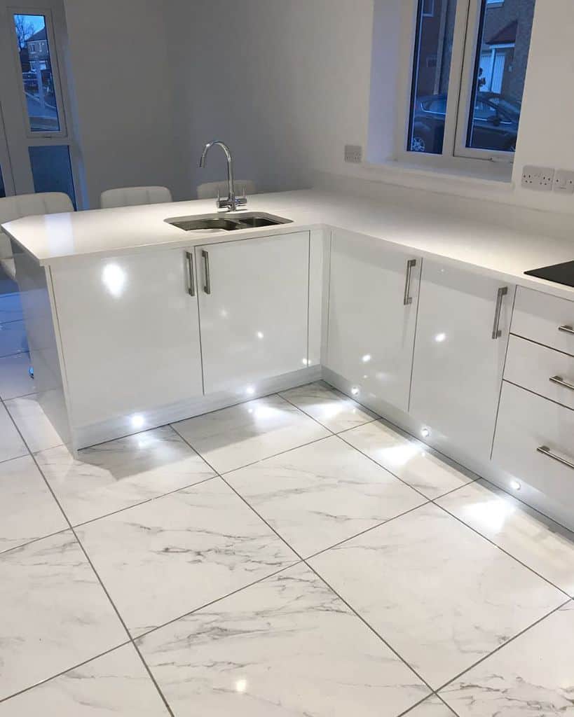glossy marble floor tiles white cabinets with led lighting