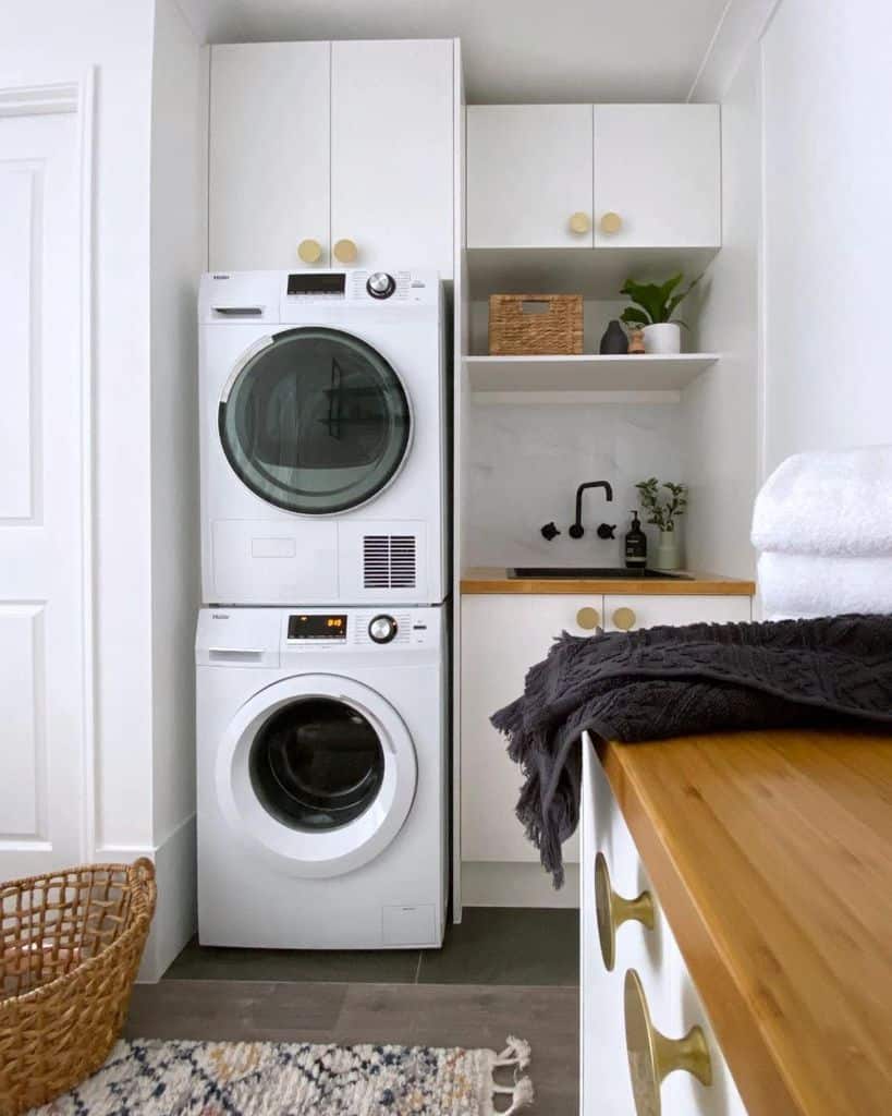 white cabinet laundry stacked vertical washer and dryer 
