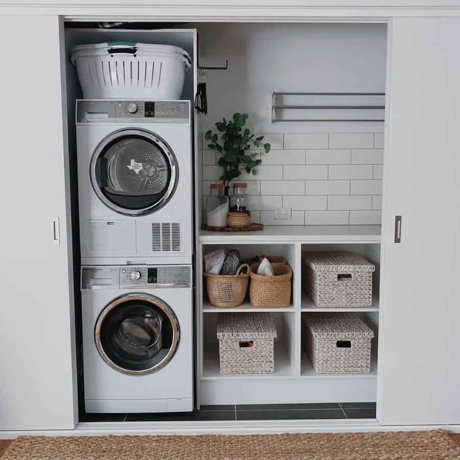 stacked washer and dryer laundry closet subway wall tiles 