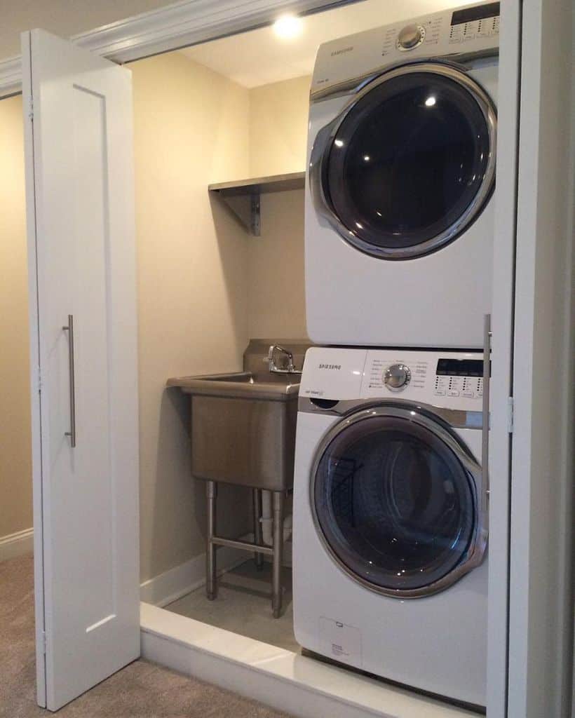 stacked washer and dryer in hidden laundry room