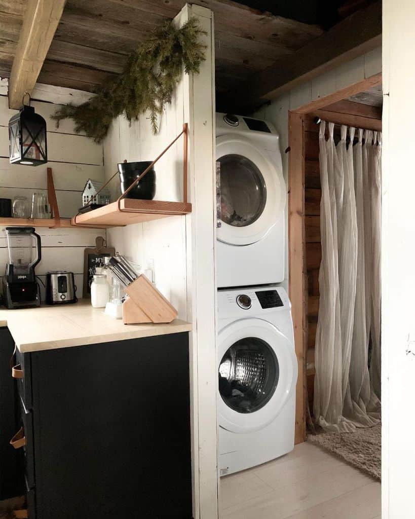 stacked washer and dryer in rustic home