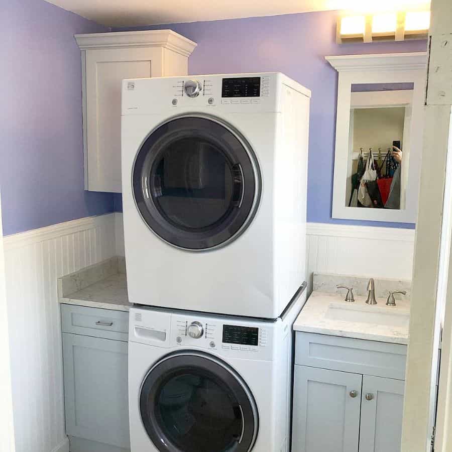 stacked small laundry with purple accent wall