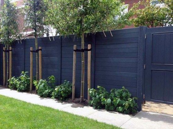 black painted wood fence backyard