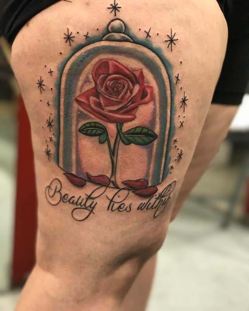 A colorful Beauty and the Beast rose in a glass dome with the quote "Beauty Lies Within," surrounded by sparkling stars