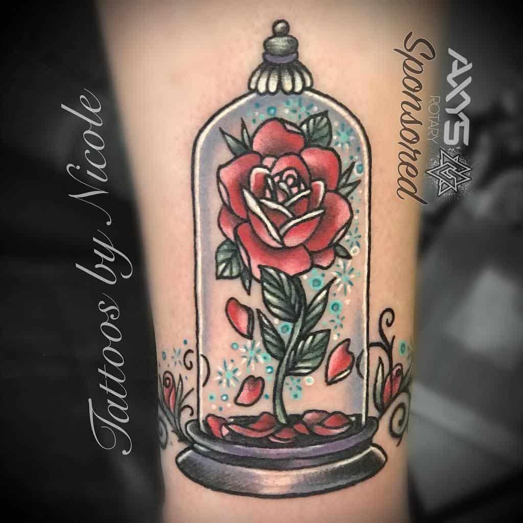 A colorful tattoo of a rose under a glass dome