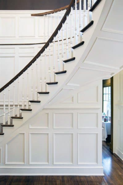 curving staircase with white trim