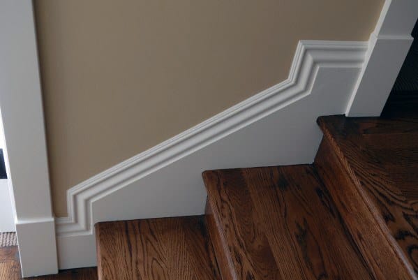 wooden stairs with white trim