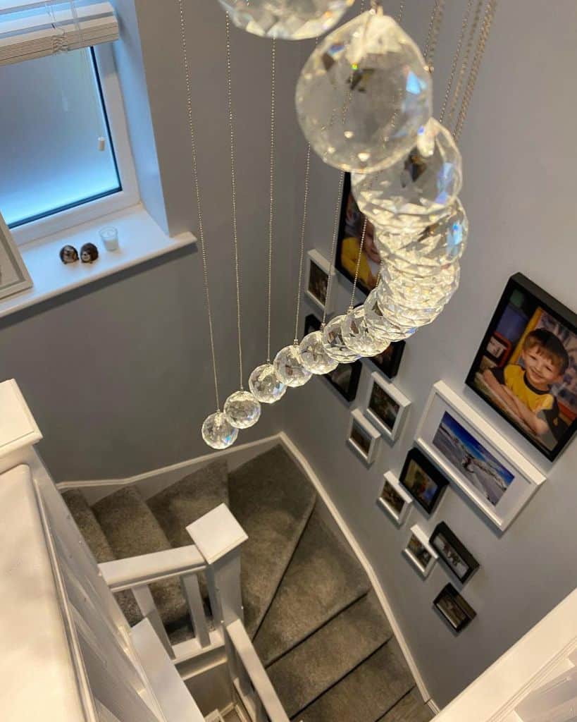 family photos hanging by stairs 