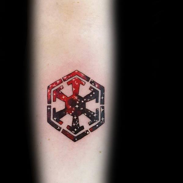 Sith Empire symbol tattoo with a galaxy-themed fill in red, black, and white, blending cosmic stars into the bold geometric design.