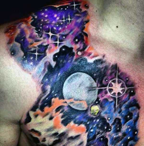 Colorful space-themed tattoo on a person's chest with stars, clouds, and a planet