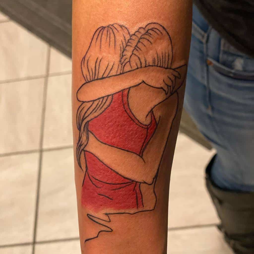 Tattoo of two sisters embracing, drawn in a minimalistic line-art style with a red top adding color