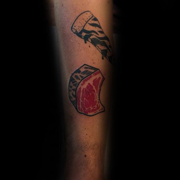 Tattoo of a thick-cut steak with bold black outlines and red shading, paired with a cleaver featuring a zebra-patterned handle for a unique design.