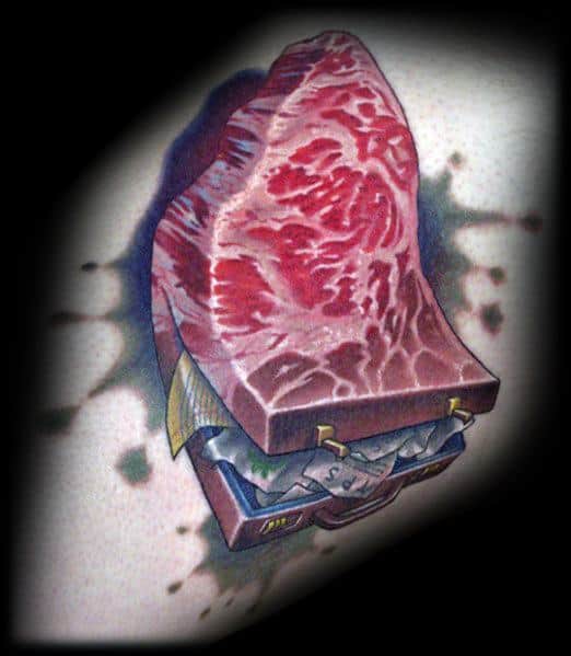 Tattoo of a realistic raw steak transforming into a briefcase filled with money, featuring detailed shading and a surreal, thought-provoking design.