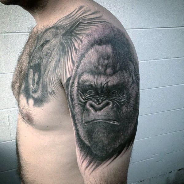 Stern Looking Gorilla Tattoo On Mans Upper Arm