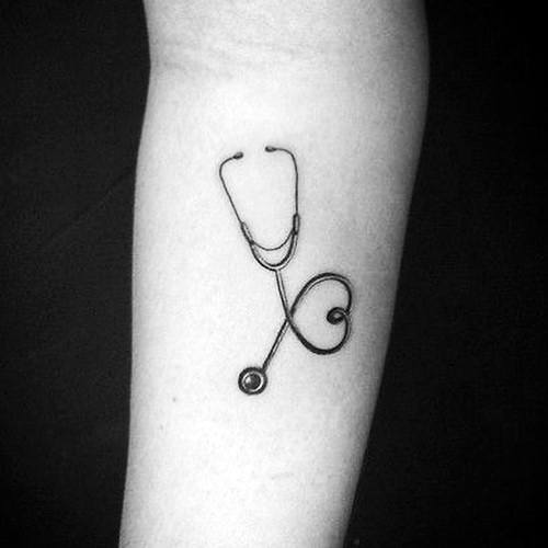 Minimalist stethoscope tattoo on the forearm, with the tubing forming a heart shape, symbolizing passion and dedication to the medical profession.