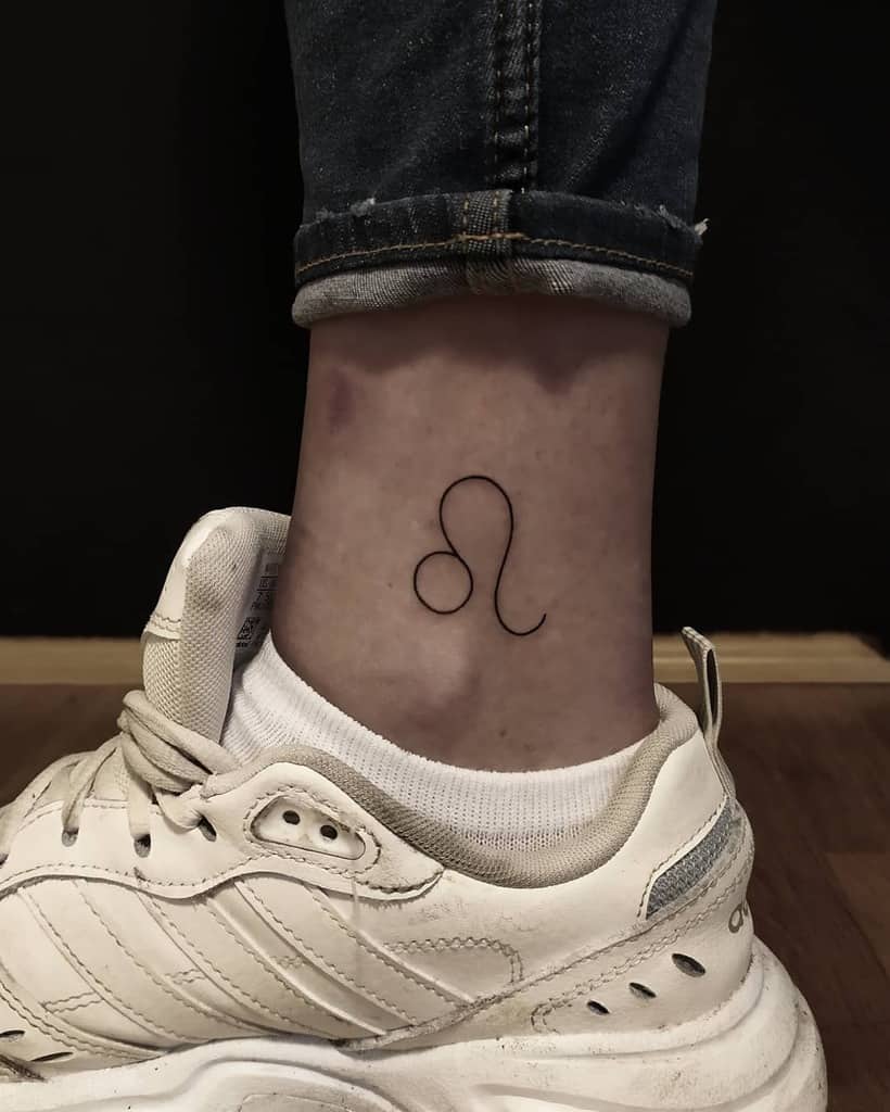 Minimalist Leo zodiac tattoo placed above the ankle, blending astrology with a subtle aesthetic.