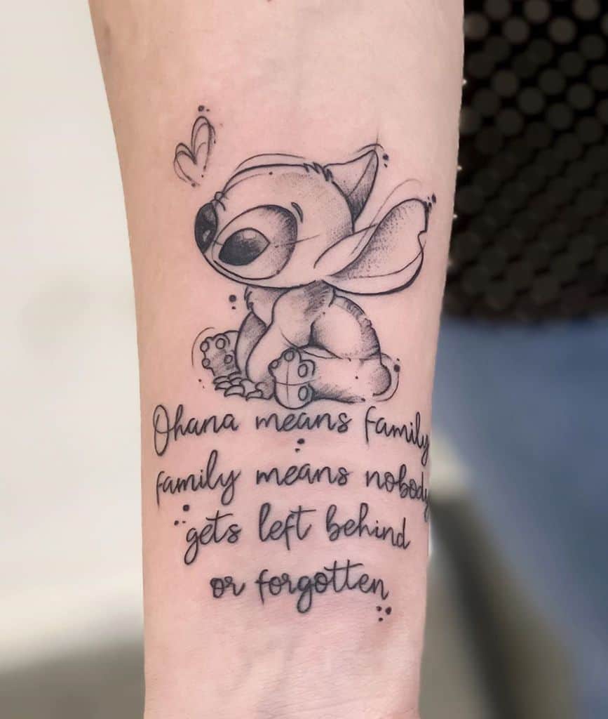 Black and grey tattoo of Stitch with 'Ohana means family' quote, symbolizing love, loyalty, and the importance of family.