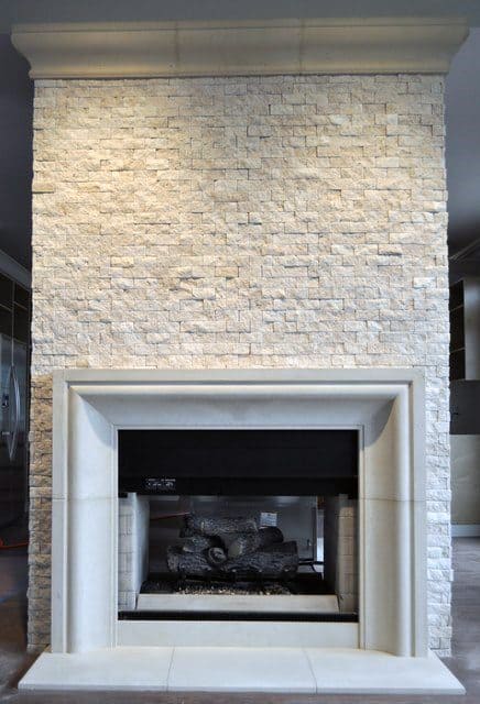 Elegant stone fireplace with a textured surround and clean, minimalist design.