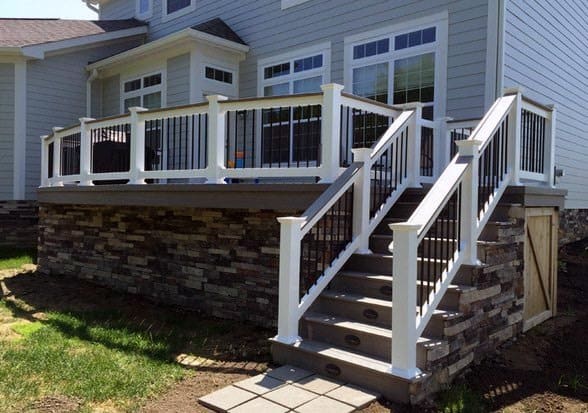stone home backyard designs deck skirting white rails black balusters