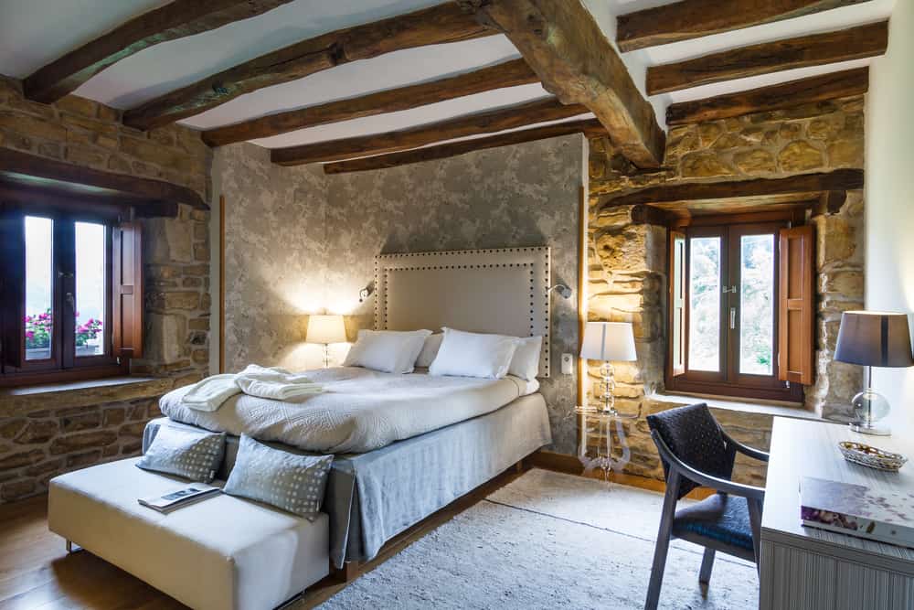 stone wall bedroom in cabin style home