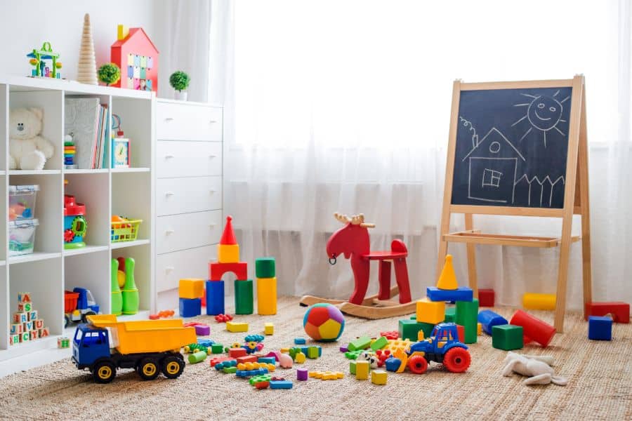 kids playroom with chalkboard and toys