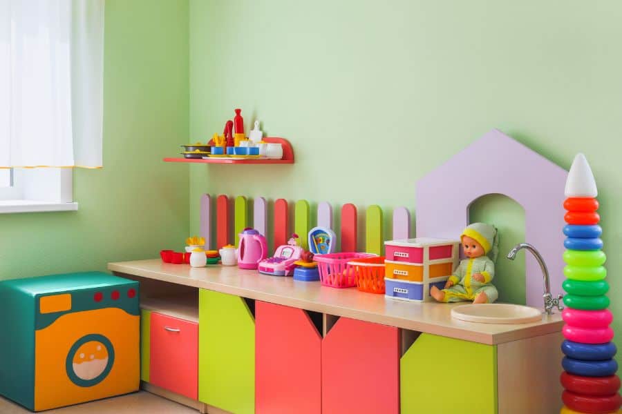 colorful storage cabinet green accent wall kids playroom