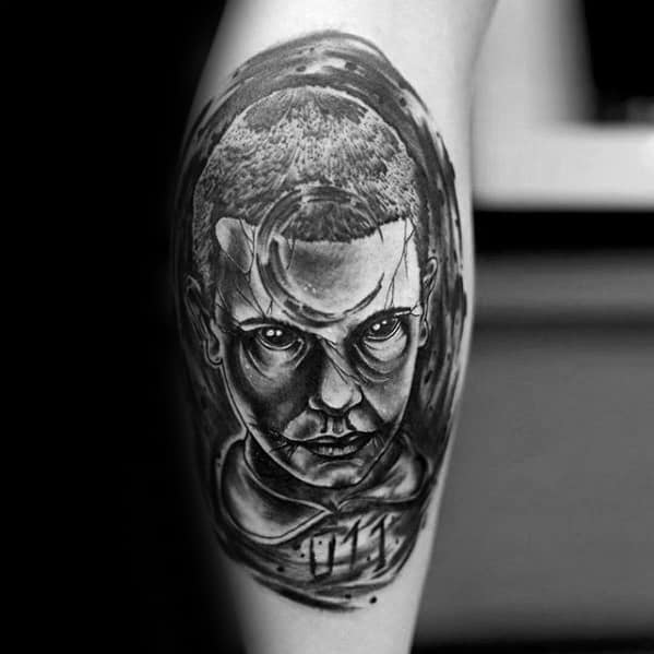 Dark black and grey tattoo of Eleven with intense eyes and blood from her nose, featuring the number 011 below her neck.