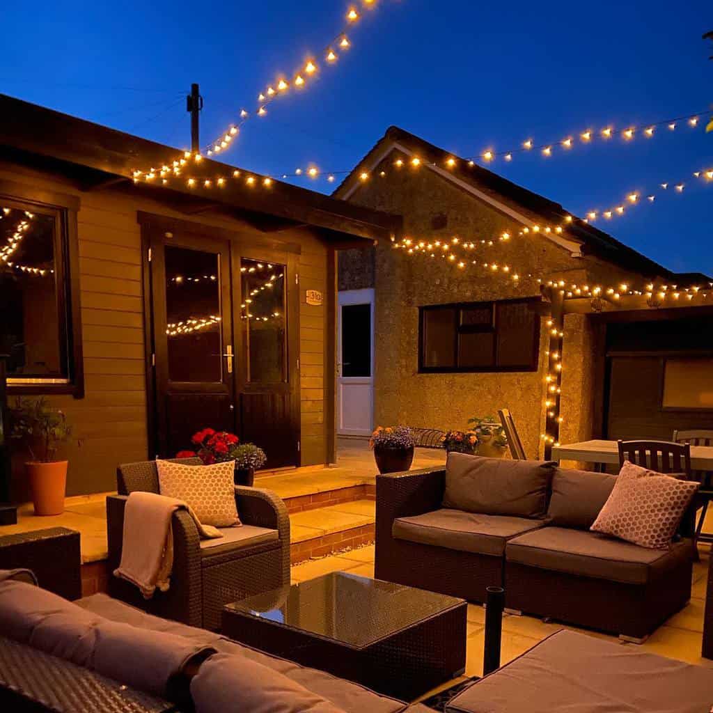 backyard patio lit by string lights