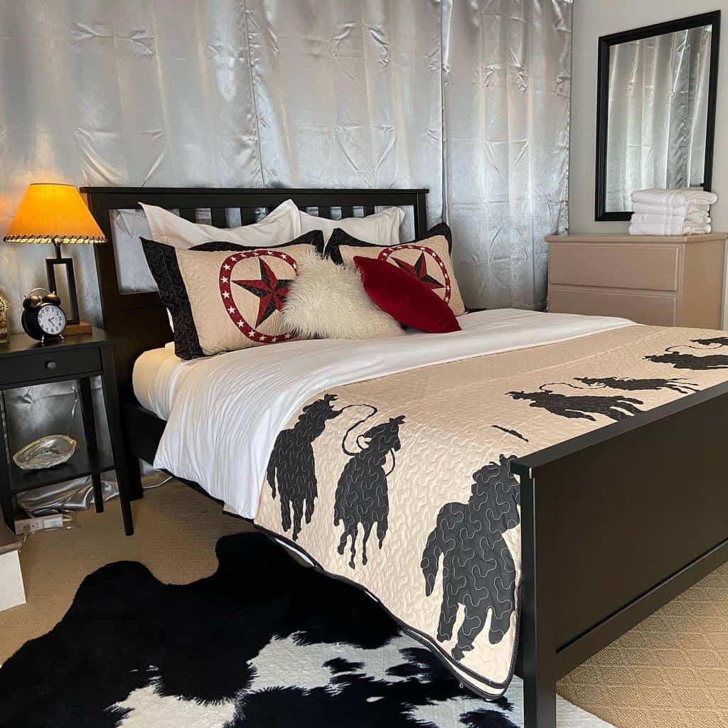 Western-themed bedroom with cowboy bedding, cowhide rug, and silver curtains.