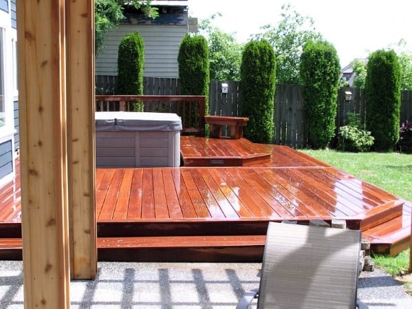 hot tub varnished wood deck backyard