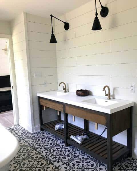 wall sconces on white shiplap bathroom wall