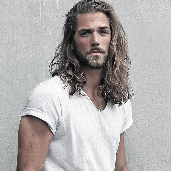 Stylish Man with Long Hair and Short Beard