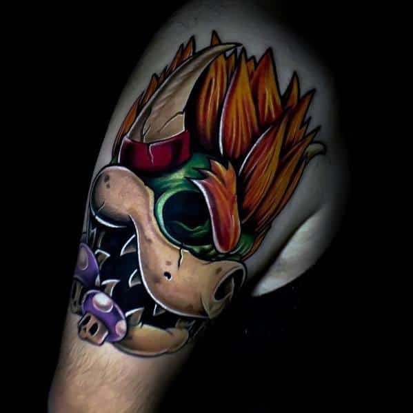 Dark Bowser tattoo on a man's shoulder featuring bold shading, fiery hair, and eerie purple mushrooms, creating a menacing and striking design.