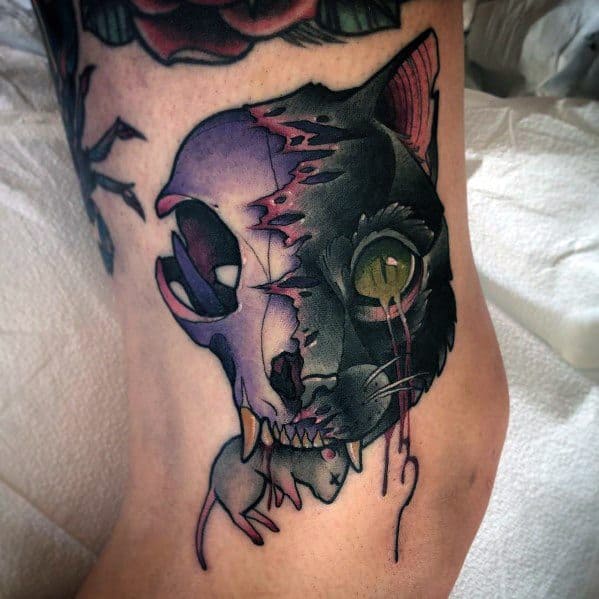 Dark neo-traditional tattoo of a half-decayed black cat with an exposed skull and dripping details, creating a bold and eerie design.