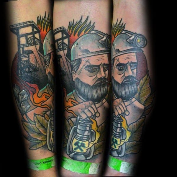 Colorful forearm tattoo of a bearded miner holding a lantern, with flames, leaves, and a mining tower in the background.