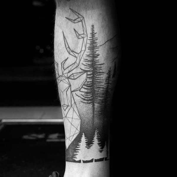 Black and grey tattoo featuring a geometric stag with detailed pine trees and a mountain landscape, blending modern and natural elements.
