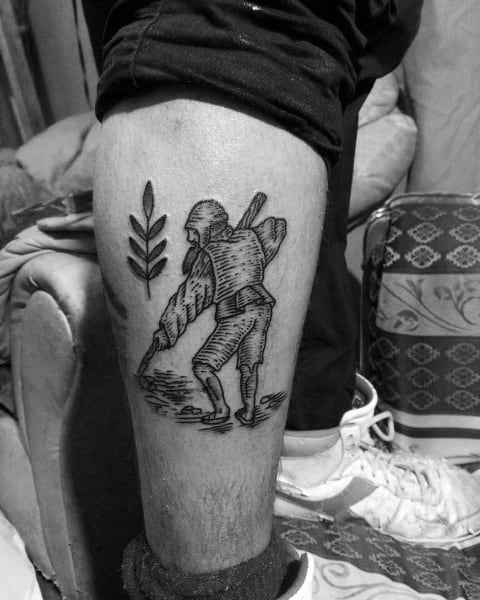 Blackwork tattoo of a traditional farmer sowing seeds, with a large wheat stalk design beside him, done in woodcut-style linework.