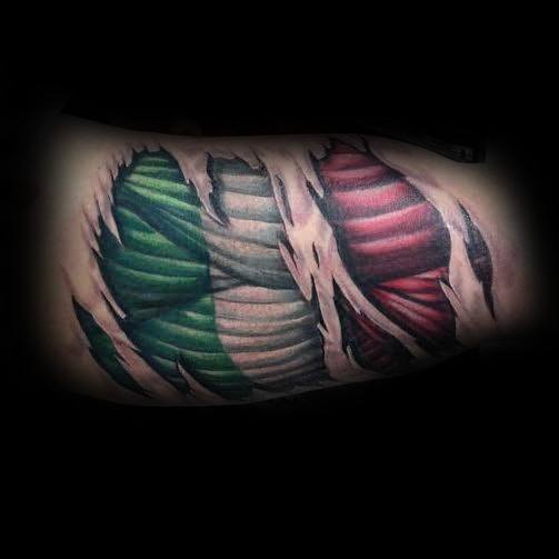Chest tattoo featuring black boxing gloves hanging over an Italian flag, symbolizing strength, resilience, and pride in heritage.