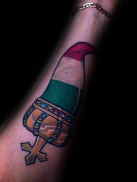 Italian horn tattoo with a jeweled crown and tricolor design, symbolizing heritage, luck, and protection.