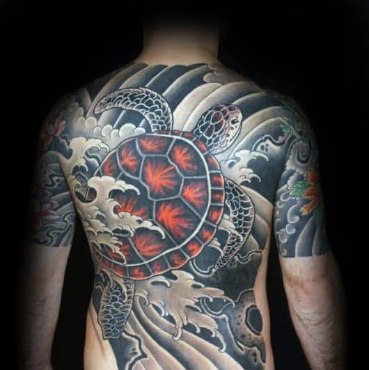 Japanese-style full-back tattoo featuring a vibrant red-shelled turtle, crashing waves, and intricate shading, symbolizing strength and perseverance.