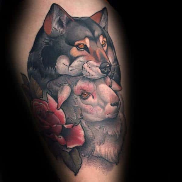 Neo-traditional tattoo of a wolf and a sheep, symbolizing duality, with bold shading, a red rose, and intricate details for a striking contrast.