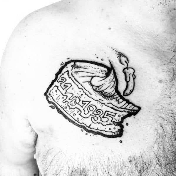 Black and white pie slice tattoo with whipped cream and a date inscribed in the filling, designed as a meaningful tribute or memorial piece