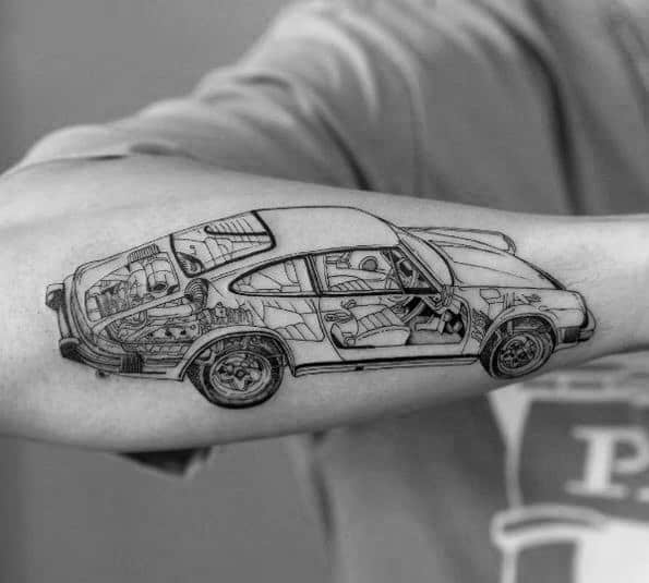 Intricate Porsche tattoo on the forearm with a detailed cutaway revealing interior mechanics and design elements.