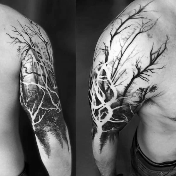 Tattoo of a leafless tree with its reflection in water, featuring bold contrast and intricate shading for a dramatic and nature-inspired design.