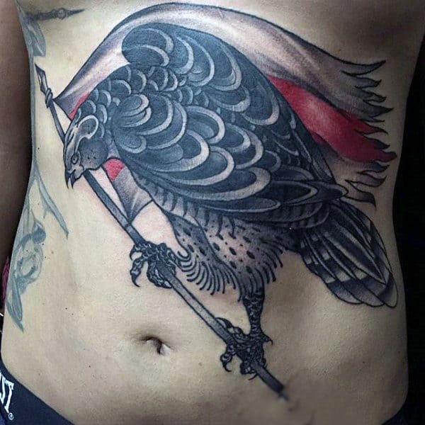 Stylized Hawk Wthi Tattered Flag Tattooon Mans Stomach