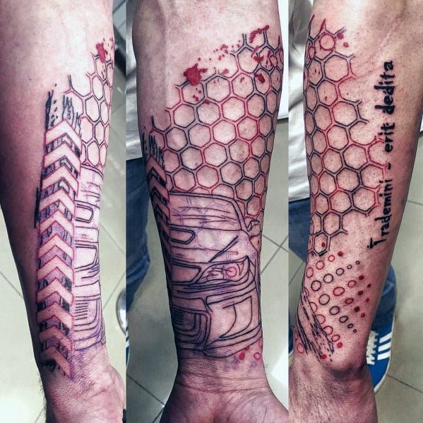 Abstract Subaru-themed forearm tattoo featuring a stylized WRX design, honeycomb patterns, red splatter effects, and the phrase "Inademni erit delita."