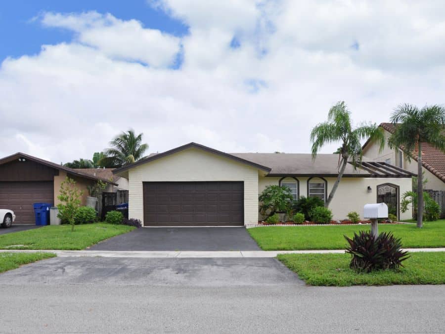 small suburban style house with two car garage