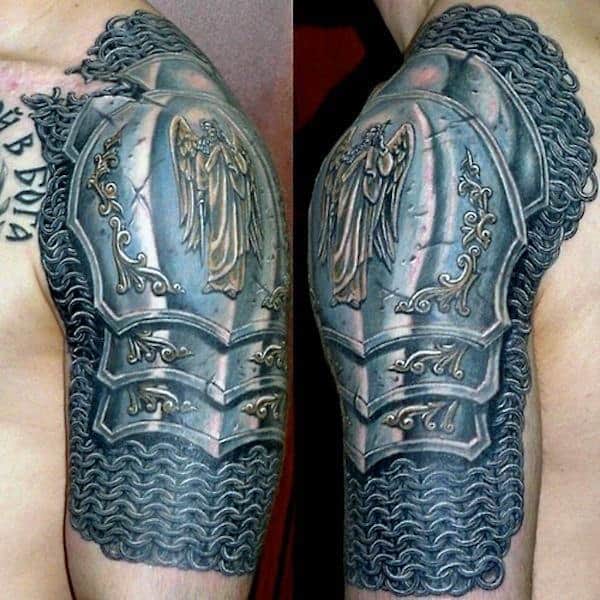 Tattoo of a detailed medieval knight's armor on an upper arm, featuring intricate designs