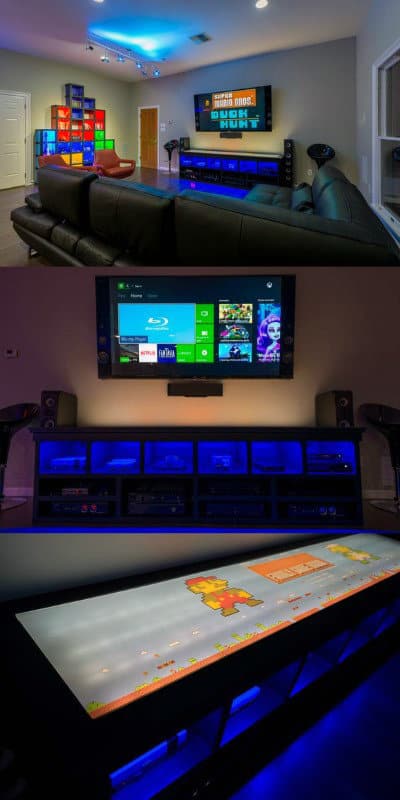 Modern home theater with a large screen, colorful shelving, and ambient LED lighting